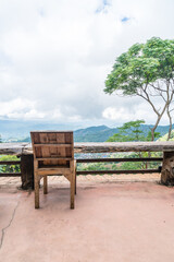 wood bar and chair with mountain hill background