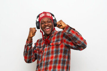 Overjoyed millennial black teenage having fun listening to music