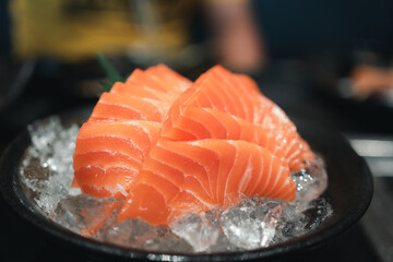 Salmon sashimi slice fresh serve on ice. Japanese traditional food or with low calories and high nutrition and healthy diet dish.