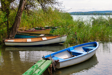 Naklejka na ściany i meble Boats moored behind the reeds on Lake Balaton - Tihany, Hungary