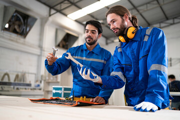 Colleagues working at furniture factory