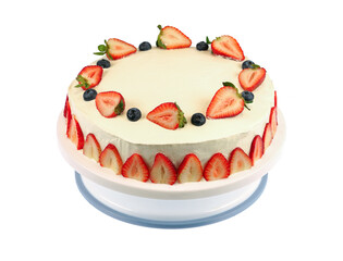 close up on fresh birthday cake with sliced strawberry