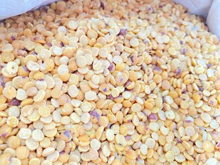 beans in a pile and background yellow rahar dal