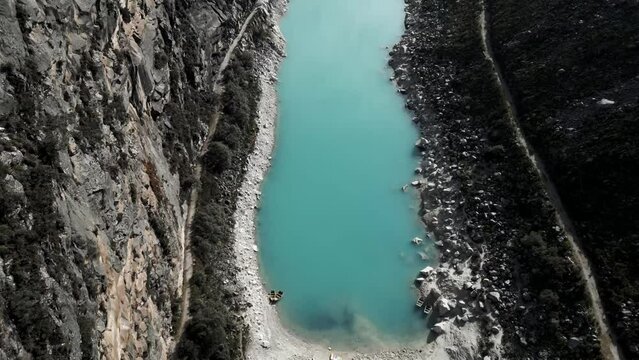 Aerial Above Laguna Paron Turquoise Water Peruvian Andes Lake Between Mountains and Pyramid Peak, Trekking Travel Destination in the Cordillera Blanca, Peru