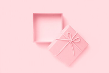 Top view of empty open pink gift box for congratulations on pink background