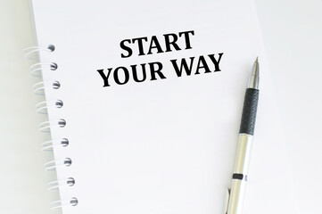 Notepad with the inscription START YOUR WAY. Finance or business concept.