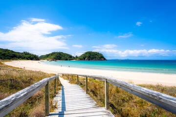 Fototapeta na wymiar Matapouri Beach in Summer with glowing clear water at Northland, New Zealand