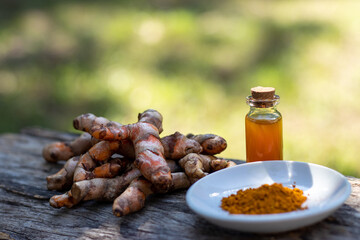 Turmeric, bar soap on wooden background. spa concept.
