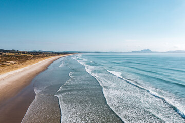 Big waves at New Zealand blue-water Uretiti Beach