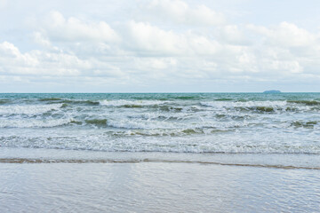 Sea waves are splashing on the shore.