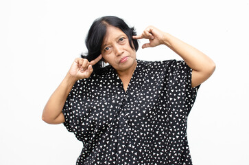 Portrait of happy ecstatic senior asian woman in overjoyed,surprised and shocked expression