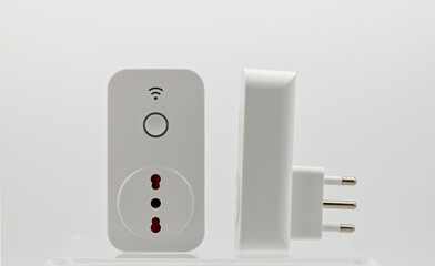 Smart wi-fi plug with energy monitor isolated on white background.