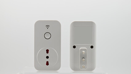 Smart wi-fi plug with energy monitor isolated on white background.