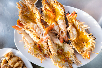 fresh grilled shrimps, grilled fresh giant river prawns, cutting half shrimp burn served with Seafood salad.