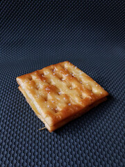 tasty crackers isolated on Dark background