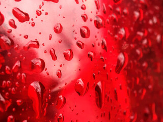 water drops at metallic surface reflecting water and light. waterdrops. raindrops