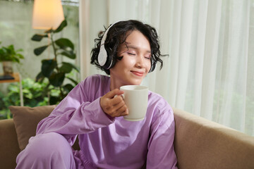 Girl Drinking Coffee and Listening Music