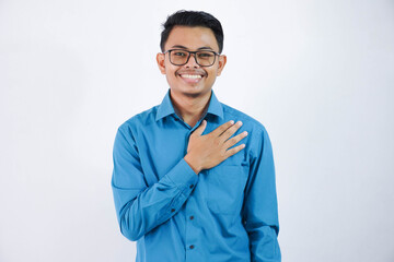 positive or smiling asian employee man putting hands on the chest or respect character wearing blue...