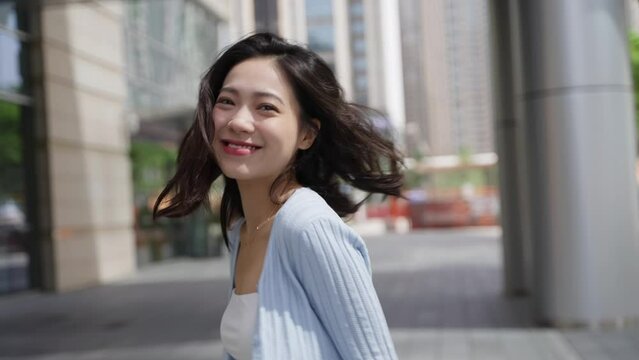Charming young asian woman looking at camera smile young people portrait