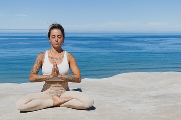 Fototapeta na wymiar prayer hands Anjali Mudra yoga on the beach meditation