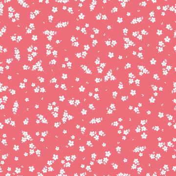 Cute floral pattern. Seamless vector texture. An elegant template for fashionable prints. Print with small white flowers and  leaves. pink background.