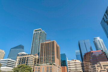 Fototapeta na wymiar Austin, Texas- Cityscape in a low angle view against the blue sky background
