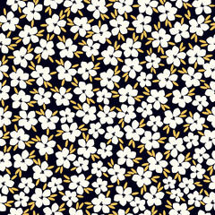 Cute floral pattern. Seamless vector texture. An elegant template for fashionable prints. Print with white flowers and yellow  leaves. black background.