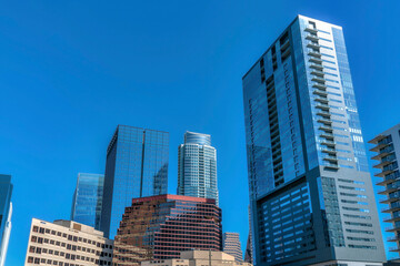Fototapeta na wymiar Austin, Texas- Cityscape with modern high-rise buildings with a reflection of blue sky