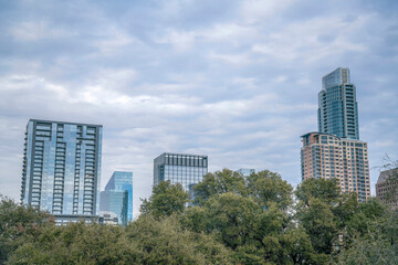 Fototapeta na wymiar Residential and corporate high-risers against the cloudy sky- Austin, Texas