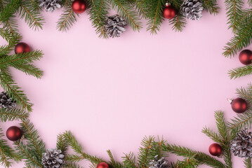 Fototapeta na wymiar Christmas background with natural fir tree branches and decoration. Xmas background with copy space