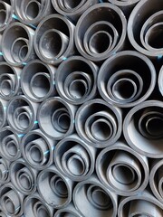 The stack of HDPE (high density polyethylene) pipes shot close up inside the warehouse