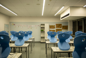 View of empty classroom in a german school with motivational phrases in german in the background