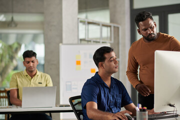 Fototapeta premium Lead UX Designer Helping Colleague