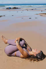 apanasana knees to chest pose yoga on the beach