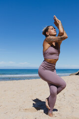 eagle pose yoga on the beach