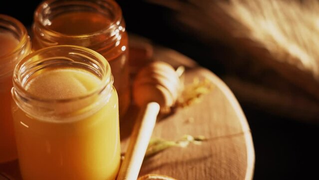Honey comb and a jar of honey. A useful fortified bee product for health and beauty. Vegetarian dietary organic product
