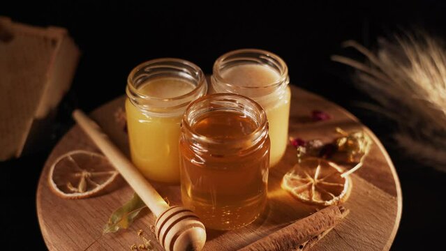 Honey comb and a jar of honey. A useful fortified bee product for health and beauty. Vegetarian dietary organic product