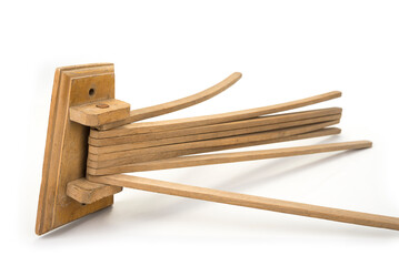 Vintage wooden washed clothes dryer on a white