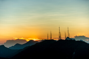 sunset over the transmission towers in rio de janeiro, view from the statue of christ