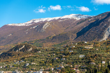 Fototapeta na wymiar Mountain range of the Monte Baldo view from the small Malcesine village, tourist resort on the coast of Lake Garda (Lago di Garda), Verona province, Veneto, Italy, southern Europe.