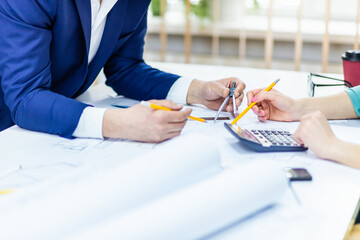 Close up photo of hands working with papers at office.