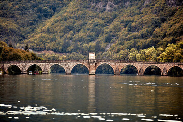 Fototapeta premium Bridge on river Drina, famous historic Ottoman architecture in Visegrad, Bosnia and Herzegovina.