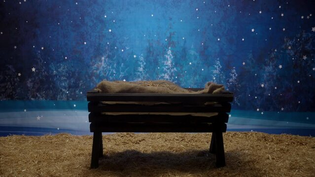 A reveal of a manger in a stable.