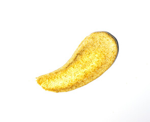 Creamy natural golden scrub on white Isolated background. Swatch. Liquid cosmetic, smudge texture