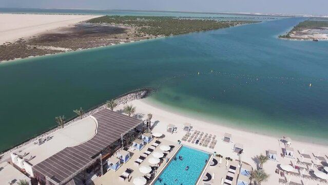 Aerial view of Yas Island, beach and skyline on a sunny day, UAE