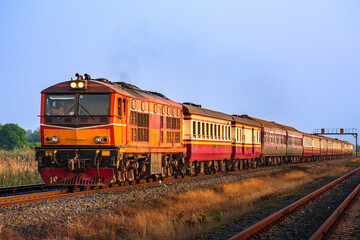 Fototapeta na wymiar Passenger train by diesel locomotive on the railway.