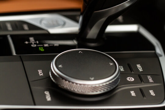 MOSCOW, RUSSIA - FEBRUARY 05, 2022 The BMW idrive console. Central console of the new BMW iDrive. The iDrive button in BMW interior.