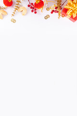 Chinese New Year on white background. Lunar New Year greeting card with traditional festival decoration - ginkgo biloba, golden twigs, gift boxes, red berries, gift envelopes, coins, chinese lanterns