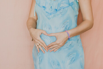 pregnant woman in blue dress