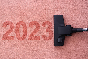 Refreshing in the New year 2023 concept for cleaning home cleaning with vacuum cleaner on carpet...